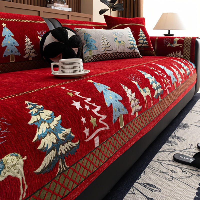 Sofabezug Weihnachten in Rot mit Tannen und Hirschen auf einem Sofa