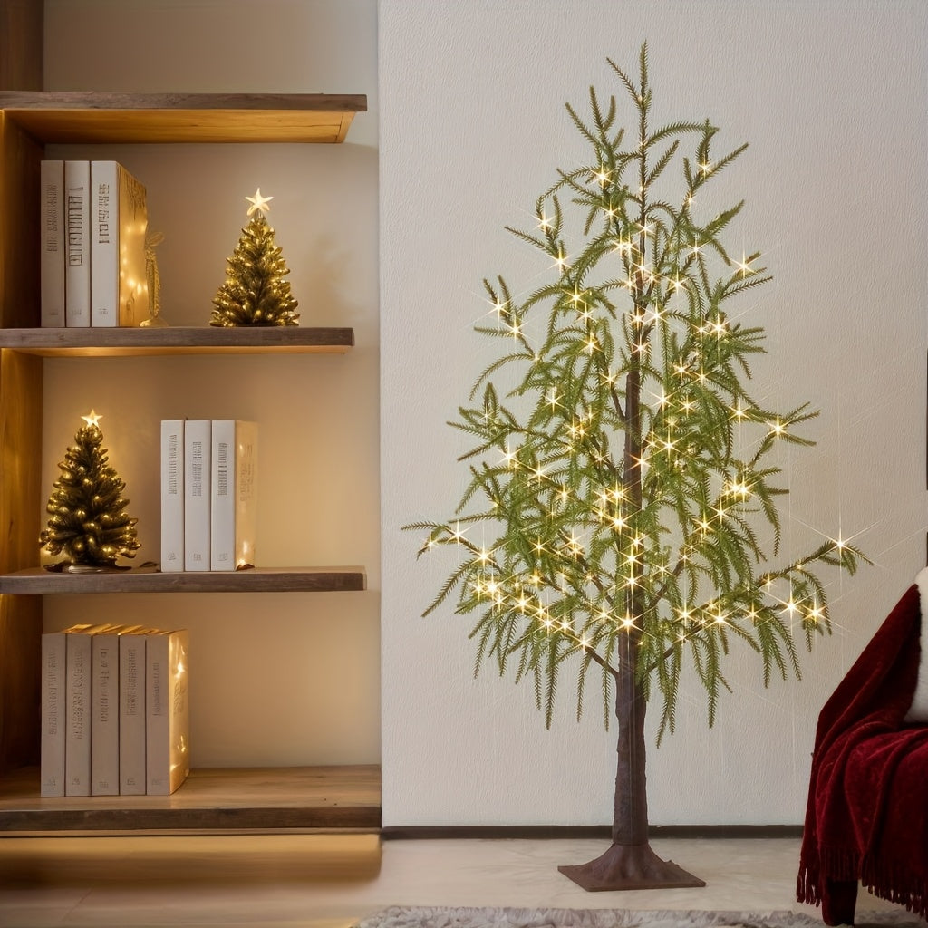 LED Baum mit grünen Blättern vor einem Bücherregal mit weihnachtlicher Deko