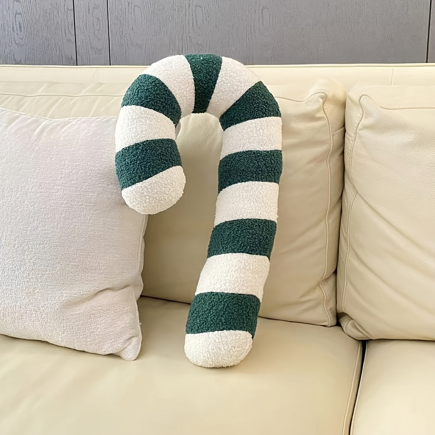 Grünes Zuckerstange Kissen auf einem hellen Sofa